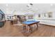 Game room features pool table, shuffleboard, and lounge area at 4308 Sunrise Flats St, Las Vegas, NV 89135