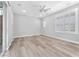 Bright living room featuring wood-look floors and plantation shutters at 4308 Sunrise Flats St, Las Vegas, NV 89135