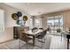 Modern dining room with a large wooden table and access to the backyard at 4420 E Brusca Way, Pahrump, NV 89061