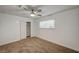 This bedroom features neutral carpet, a ceiling fan, a window, and a closet at 4457 Dennis Way, Las Vegas, NV 89121