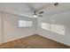 Bright bedroom with ceiling fan, carpet, and mirrored closet at 4457 Dennis Way, Las Vegas, NV 89121