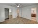 Bedroom with carpet, closet and view into the bathroom at 4457 Dennis Way, Las Vegas, NV 89121