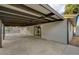 This large carport is covered with a wooden beam structure and a concrete floor at 4457 Dennis Way, Las Vegas, NV 89121