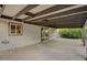 This large carport is covered with a wooden beam structure and a concrete floor at 4457 Dennis Way, Las Vegas, NV 89121