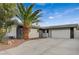 Single-story home featuring a two-car garage and low-maintenance desert landscaping at 4457 Dennis Way, Las Vegas, NV 89121