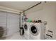 This garage features a laundry area with a washer and dryer, and a garage door at 4457 Dennis Way, Las Vegas, NV 89121