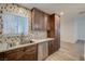 Modern kitchen with sink, stainless steel appliances, and wood cabinets at 4457 Dennis Way, Las Vegas, NV 89121