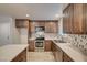 Modern kitchen with stainless steel appliances and a stylish backsplash at 4457 Dennis Way, Las Vegas, NV 89121