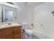 Bathroom with a bathtub, toilet and wood vanity at 4850 Aveneda Grande, Las Vegas, NV 89121