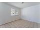 Bright bedroom featuring tile flooring and a window with blinds at 4850 Aveneda Grande, Las Vegas, NV 89121