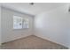 Bright bedroom with carpeted floors and a window with blinds at 4850 Aveneda Grande, Las Vegas, NV 89121