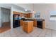 View of kitchen, island, and adjacent living space at 4850 Aveneda Grande, Las Vegas, NV 89121