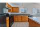 Kitchen boasts wood cabinets and black appliances at 4850 Aveneda Grande, Las Vegas, NV 89121