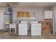 Unfinished laundry room with washer, dryer, and utility sink at 4850 Aveneda Grande, Las Vegas, NV 89121