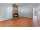 Living room with wood floors and a brick fireplace at 4850 Aveneda Grande, Las Vegas, NV 89121