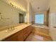 Bathroom boasts double vanity and a relaxing tub at 4974 Crooked Stick Way, Las Vegas, NV 89113