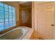 Bathroom features a walk-in shower and tub at 4974 Crooked Stick Way, Las Vegas, NV 89113