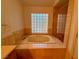 Spa-like bathroom with a large jetted tub at 4974 Crooked Stick Way, Las Vegas, NV 89113