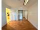 Bedroom with hardwood floors and mirrored closet doors at 4974 Crooked Stick Way, Las Vegas, NV 89113