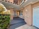 Front entrance with a decorative door and shrubbery at 4974 Crooked Stick Way, Las Vegas, NV 89113