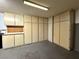 Garage with built-in storage cabinets and pegboard at 4974 Crooked Stick Way, Las Vegas, NV 89113