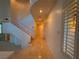 Bright hallway with tiled floors and staircase at 4974 Crooked Stick Way, Las Vegas, NV 89113