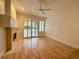 Living room with hardwood floors, fireplace, and sliding doors at 4974 Crooked Stick Way, Las Vegas, NV 89113