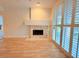 Living room features a fireplace and hardwood floors at 4974 Crooked Stick Way, Las Vegas, NV 89113