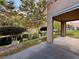 Covered patio overlooking a pond and community landscape at 4974 Crooked Stick Way, Las Vegas, NV 89113