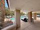 View of the community pool from under a covered patio at 4974 Crooked Stick Way, Las Vegas, NV 89113