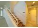 Modern staircase with wood steps and white walls at 4974 Crooked Stick Way, Las Vegas, NV 89113