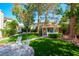 Landscaped backyard with gazebo, artificial turf, and patio furniture at 56 Sawgrass Ct, Las Vegas, NV 89113