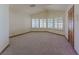 This bedroom features a high ceiling, and many windows that allow natural light to come in at 56 Sawgrass Ct, Las Vegas, NV 89113