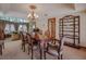 Formal dining room with a chandelier and ornate wood table at 56 Sawgrass Ct, Las Vegas, NV 89113