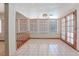 Tiled sun room with many windows and natural light, offering great view to the outside at 56 Sawgrass Ct, Las Vegas, NV 89113