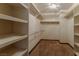 Spacious walk-in closet with built-in shelving and hanging rods for optimal organization at 56 Sawgrass Ct, Las Vegas, NV 89113