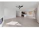 Open concept living room with kitchen views and hardwood flooring at 595 Beverly Pine Pl, Henderson, NV 89011