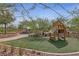 Community playground with wooden play structures and shaded seating at 595 Beverly Pine Pl, Henderson, NV 89011