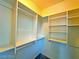 Walk-in closet with shelves and hanging rods at 6234 Hopeful Light Ave, Las Vegas, NV 89139