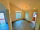 Open dining area with new flooring and chandelier at 6234 Hopeful Light Ave, Las Vegas, NV 89139