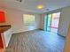 Dining area with patio access and wood-look floors at 6234 Hopeful Light Ave, Las Vegas, NV 89139