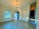 Living room with modern chandelier and wood-look floors at 6234 Hopeful Light Ave, Las Vegas, NV 89139