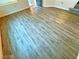 Bright living room with wood-look flooring at 6234 Hopeful Light Ave, Las Vegas, NV 89139