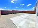 Spacious backyard with gravel and a large concrete patio at 6335 Rock Stream Ln, Las Vegas, NV 89141