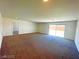 Spacious living area with sliding doors to the backyard at 6335 Rock Stream Ln, Las Vegas, NV 89141