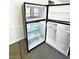 Black refrigerator with ample storage space at 6335 Rock Stream Ln, Las Vegas, NV 89141