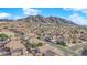 Neighborhood view with mountain backdrop; showcasing homes and landscape at 6458 Bluehurst Ave, Las Vegas, NV 89156