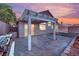 Backyard patio with pergola, built-in grill, and flagstone at 6458 Bluehurst Ave, Las Vegas, NV 89156