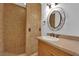 Tiled shower and vanity with granite countertop in this bathroom at 6458 Bluehurst Ave, Las Vegas, NV 89156