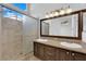 Bathroom with double vanity, granite countertop, and shower at 6458 Bluehurst Ave, Las Vegas, NV 89156